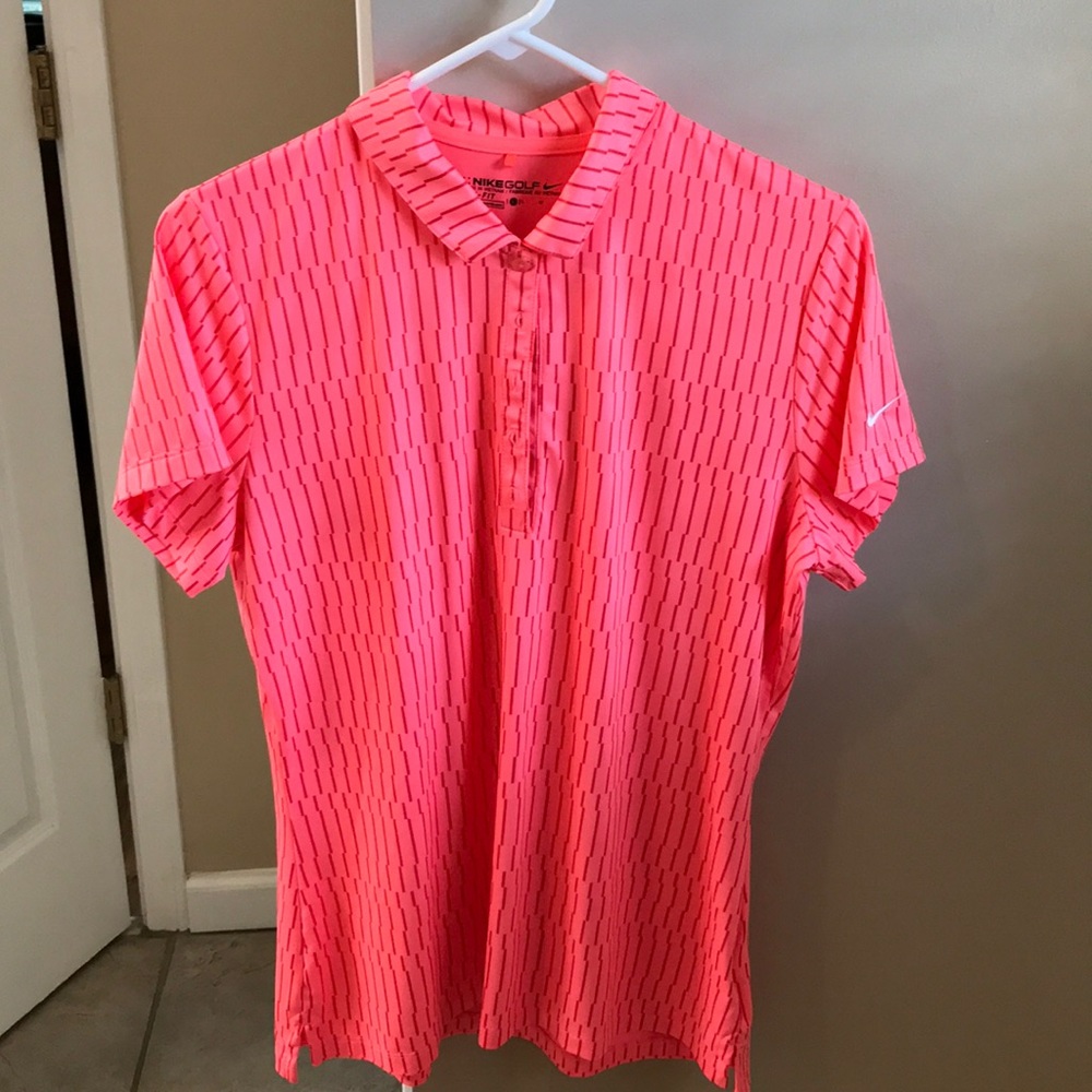 Nike size L golf shirt. Orangey/Pinkish color.